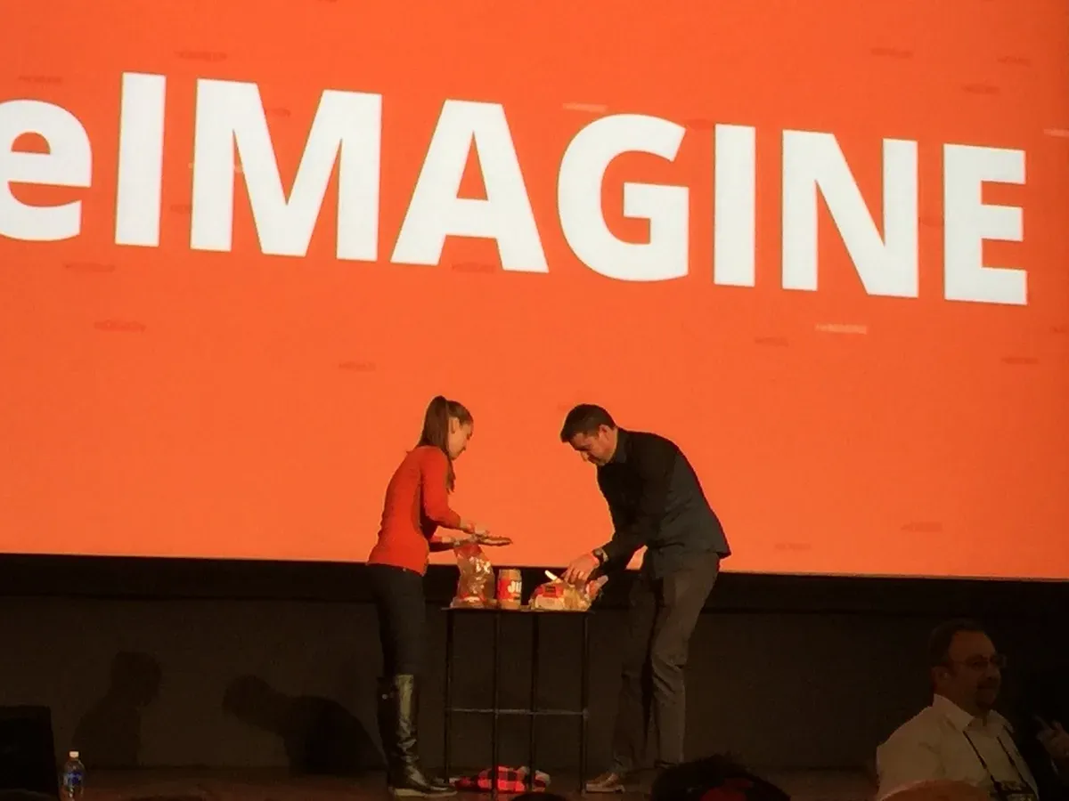 Errol and Oksana on stage making peanut butter sandwiches.