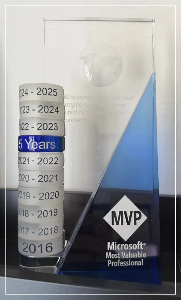 Microsoft MVP crystal award trophy with 9 stacked year rings from 2016 to 2024-2025, including a blue 5 Years milestone ring.