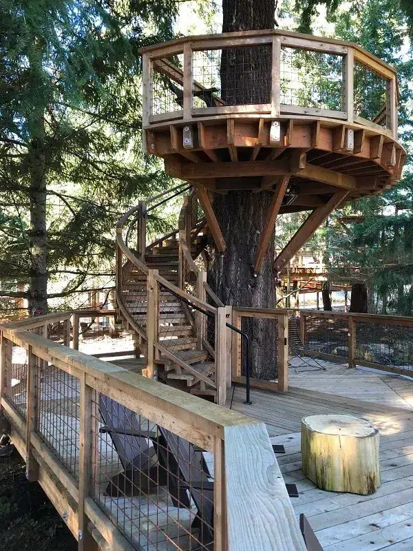 Wooden treehouse structure at Microsoft Redmond campus featuring circular observation deck, spiral staircase, and surrounding deck with railings